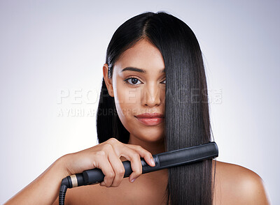 Buy stock photo Hair care, flat iron and portrait of woman with long hairstyle, luxury salon treatment and white background in Brazil. Beauty, haircut and latino model with electric straightener on studio backdrop.