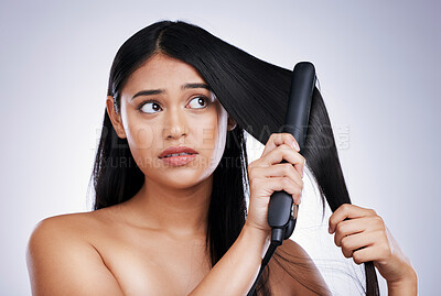 Buy stock photo Hair, concern and woman with straightener, mockup and luxury salon treatment on white background in Brazil. Beauty, heat damage and hairstyle of latino model with flat iron, stress and studio space.