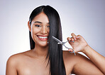 Hair, smile and portrait of happy woman with scissors on long hairstyle, luxury treatment and white background in Brazil. Beauty, healthy haircut and latino model with salon cut on studio backdrop.