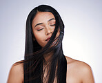 Hair, beauty and relax, woman with long hairstyle, space and luxury salon treatment on white background in Brazil. Wind, haircut and latino model with straight style blowing in air on studio backdrop