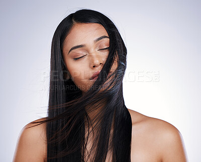 Buy stock photo Hair, beauty and relax, woman with long hairstyle, space and luxury salon treatment on white background in Brazil. Wind, haircut and latino model with straight style blowing in air on studio backdrop