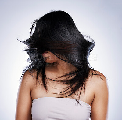 Buy stock photo Luxury, beauty and woman with hair care, grooming and and salon treatment against a studio background. Female person, girl and model with healthy scalp, shake head or growth with natural hairstyle