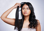 Hair care, damage and face of woman with long hairstyle, stress and luxury salon treatment on white background in Brazil. Beauty, haircut and latino model with dry, damaged style on studio backdrop.