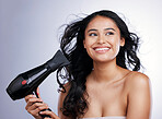 Hair care, beauty and face of happy woman with hairdryer, smile and luxury salon treatment on white background. Blow dryer, hairstyle and happiness, latino model with haircare on studio backdrop.