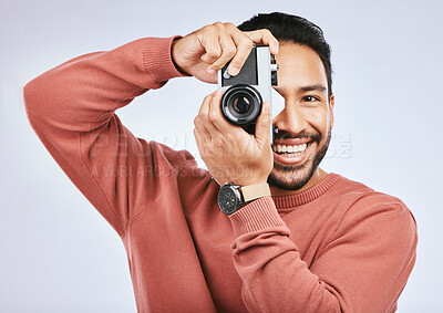 Buy stock photo Man with camera, photography and smile in portrait with creativity and art isolated on studio background. Happy male photographer, creative with artistic person and taking pictures with gadget