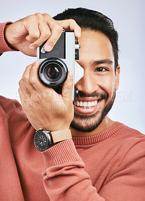 Buy stock photo Happy man with camera, photography and smile in portrait with creativity and art isolated on studio background. Male photographer, creative with artistic person and taking pictures with gadget