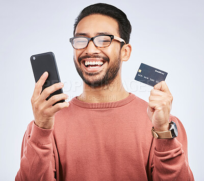 Buy stock photo Man is laugh, smartphone and credit card for online shopping, happy with discount or promo on studio background. Positive customer experience, ecommerce and fintech, funny with male person and sale