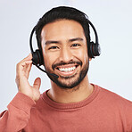 Man with headset, call center and contact us in portrait, smile with communication on studio background. Customer service, telemarketing and tech support with male consultant and help desk job