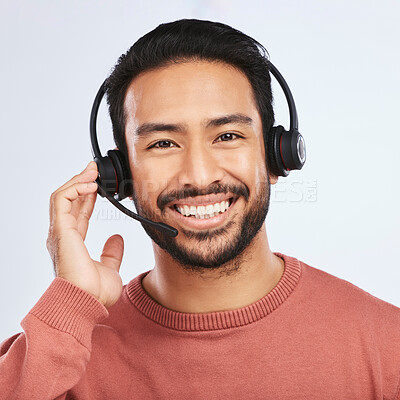 Buy stock photo Man with headset, call center and contact us in portrait, smile and communication on studio background. Customer service, telemarketing and tech support with male consultant at help desk job