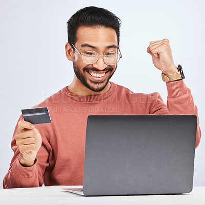 Buy stock photo Laptop, credit card and man excited for online shopping, e commerce and payment in studio. Asian male person with technology and hand to celebrate savings win, promotion or sale on a fintech website