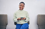 Black woman, phone and portrait on a chair in a waiting room with network connection for social media. African person happy for recruitment interview with a smartphone for internet, website or app