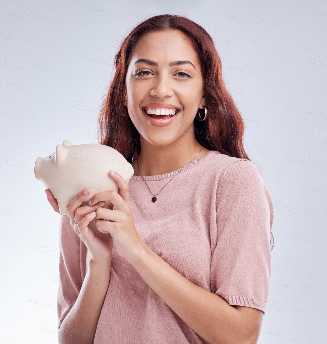 Buy stock photo Finance, portrait or happy woman with a piggy bank for financial wealth or savings on white background. Smile, investment or girl laughing or investing cash or budget in tin for safety or security