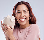 Smile, portrait or happy woman with a piggy bank for financial wealth or savings on white background. Finance, investment or woman smiling or investing cash or budget in tin for safety or security