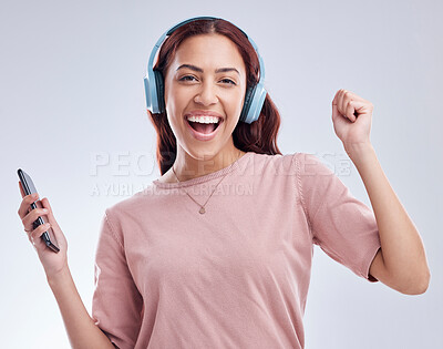 Buy stock photo Mobile, portrait or happy woman in headphones dancing music or radio audio in studio on white background. Dance, singing or girl streaming or listening to song playlist in freedom with cellphone 