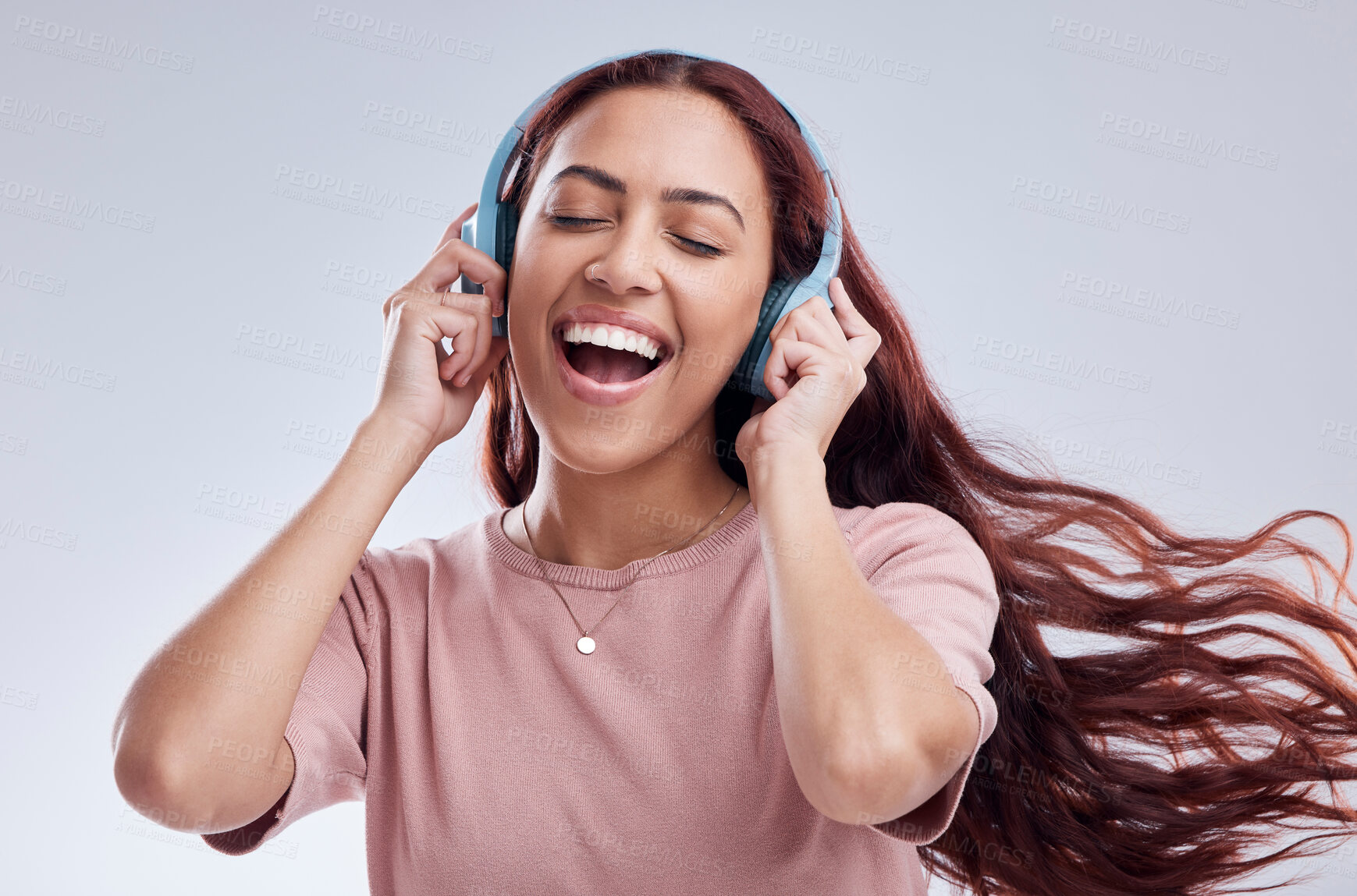 Buy stock photo Dance, headphones or happy woman singing music or radio audio smiling in studio on white background. Dancing, smile or excited gen z girl streaming or listening to online song playlist in freedom 