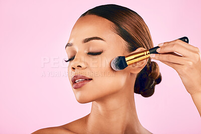 Buy stock photo Calm woman, face and brush for makeup, beauty or cosmetics against a pink studio background. Female person or model with cosmetic tools, brush or equipment for grooming or applying facial treatment