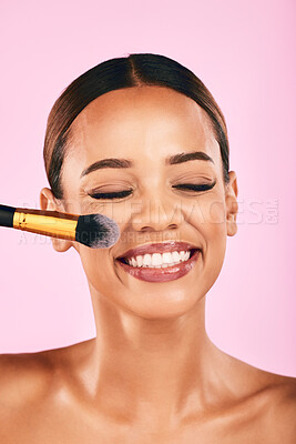 Buy stock photo Happy woman, face and makeup brush for beauty cosmetics against a pink studio background. Female person, smile and brushing with cosmetic tool or equipment for grooming, applying or facial treatment