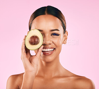 Buy stock photo Happy woman, portrait smile and avocado for natural beauty, skincare or cosmetics against a pink studio background. Female person smiling with vegetable for healthy nutrition, fiber diet or wellness