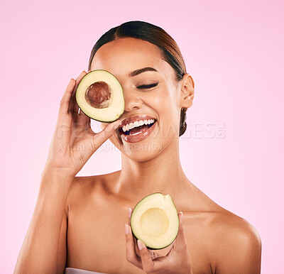 Buy stock photo Happy woman, smile and avocado for natural beauty, skincare or cosmetics against a pink studio background. Female person or model smiling with vegetable for healthy nutrition, fiber diet or wellness