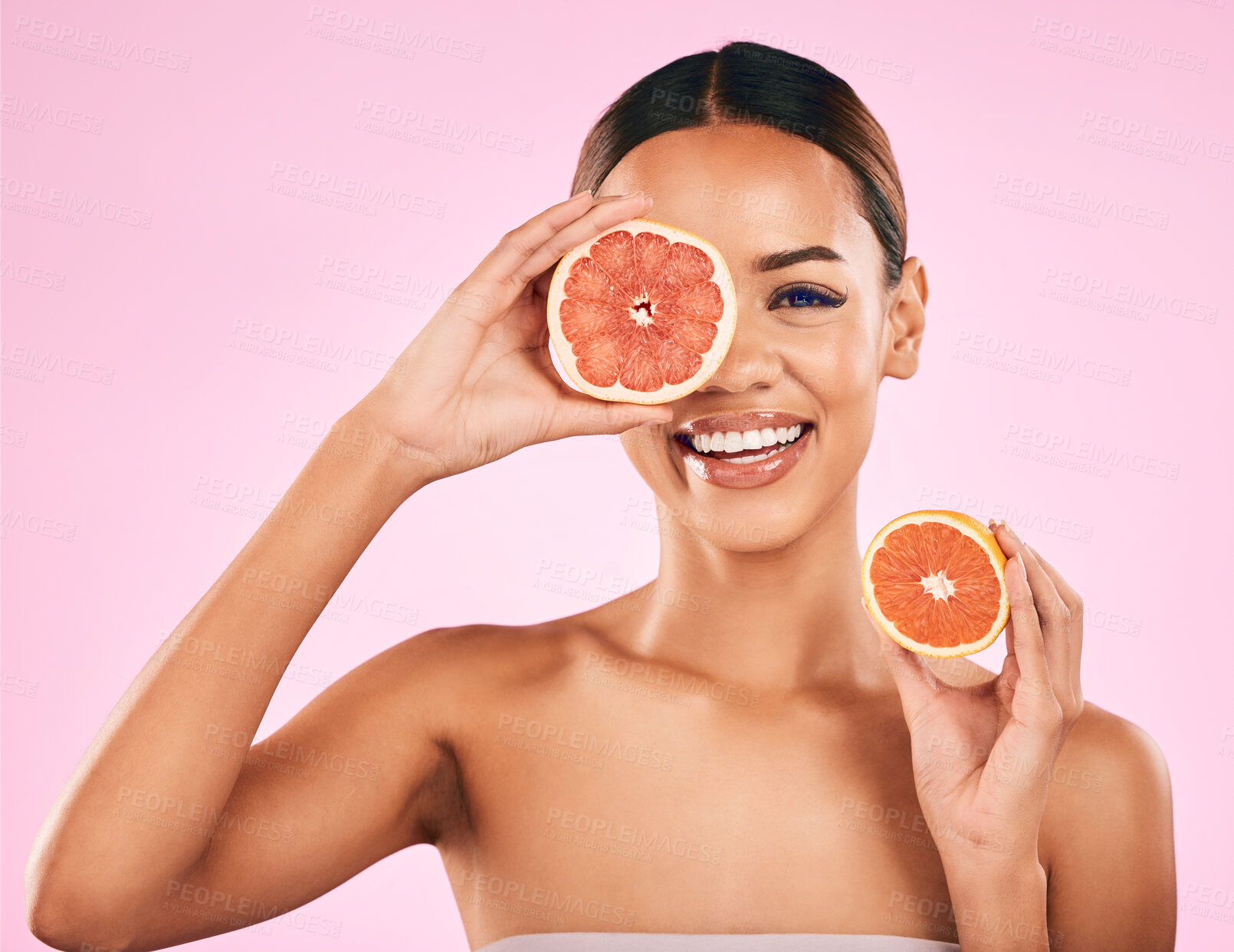 Buy stock photo Happy woman, portrait smile and grapefruit for vitamin C, nutrition or natural skincare against a pink studio background. Face of female person smiling with organic fruit for healthy diet or wellness