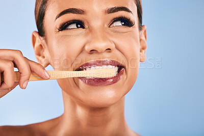 Buy stock photo Face, woman and bamboo toothbrush for cleaning, toothpaste and dental health on studio background. Teeth, clean and wash mouth with eco friendly brush for hygiene, self care and healthy tooth