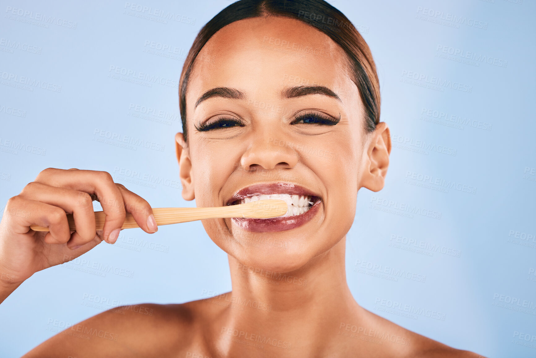 Buy stock photo Face, woman and bamboo toothbrush for cleaning, toothpaste and dental health on studio background. Teeth, clean and portrait with eco friendly wood brush for hygiene, self care and healthy tooth