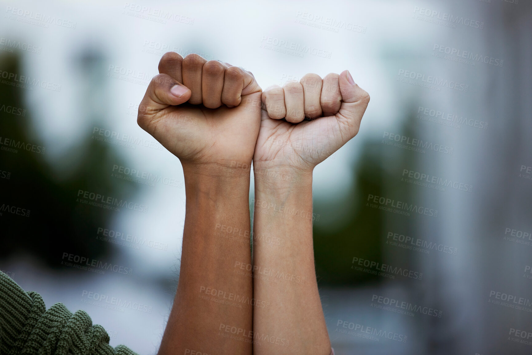 Buy stock photo Fist, protest and power by people in solidarity for justice, human rights and democracy on blurred background. Hands, diversity and men united for activism, change and transformation or community