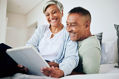 Buy stock photo Tablet, love and senior couple browsing on social media, app or the internet while relaxing on a sofa. Happy, smile and elderly man and woman in retirement networking on a digital mobile at home.