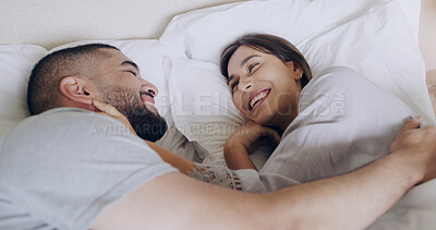 Buy stock photo Face, happy woman and relax with man in bed, room and enjoy romance of quality time together at home. Couple, relationship and laughing in morning for love, care and happiness of partner on honeymoon