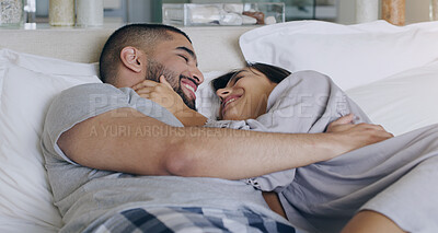 Buy stock photo Couple, love and smile in bed, bonding and romance of intimacy, special moment and trust together at home. Happy young man, woman and partner in relationship, honeymoon and relax for care in bedroom