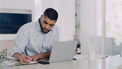 Buy stock photo Man, remote work and writing notes at laptop in home office for digital planning, online research and information. Male freelancer, notebook and working on computer technology, internet and budget