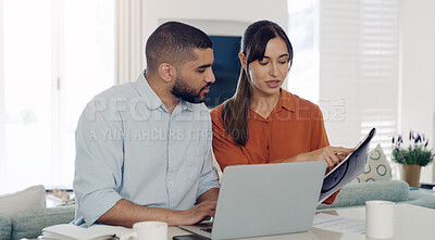 Buy stock photo Laptop, documents and couple planning bills, debt or mortgage payments together in the living room. Technology, financial paperwork and young man and woman paying with online banking in their home.