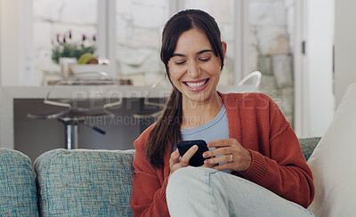 Buy stock photo Happy, woman and typing on smartphone in living room,  reading social media post and funny online meme. Female person, smile and relax with cellphone, download mobile games and web connection at home
