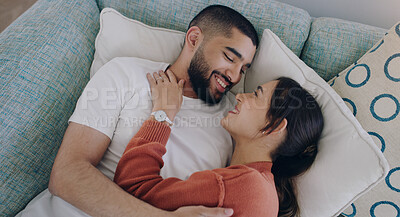 Buy stock photo Top view of happy couple, love and hug on sofa in living room for romance, intimacy and relax together at home. Young man, woman and cuddle partner on couch for relationship, quality time and care