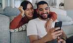 Home, sofa and couple with phone online for social media, browse website or internet news. Communication, love and happy man and woman on smartphone for quality time, bonding and relax in living room