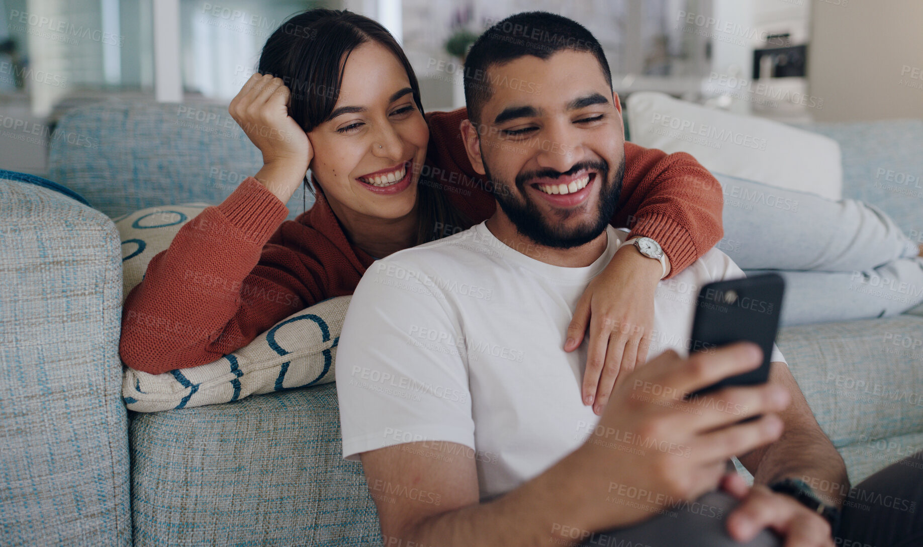 Buy stock photo Home, sofa and couple with phone online for social media, browse website or internet news. Communication, love and happy man and woman on smartphone for quality time, bonding and relax in living room