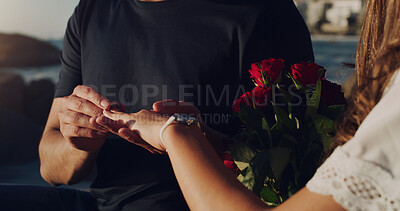 Buy stock photo Love, proposal and engagement with hands of couple in outdoor for marriage, commitment or trust. Wedding ring, roses and jewelry with closeup of man and woman for announcement, celebration and fiance