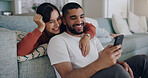 Couple, phone and laughing at meme on social media or internet joke and relax in a living room couch in a home. Sofa, cellphone and people streaming online comedy on a smartphone in a house together