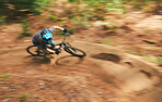 Bike, motion blur and cycling trail on path for adventure, speed and power from above. Fast athlete, extreme sports and bicycle for action, cardio and off road skill for adrenaline, freedom and racer