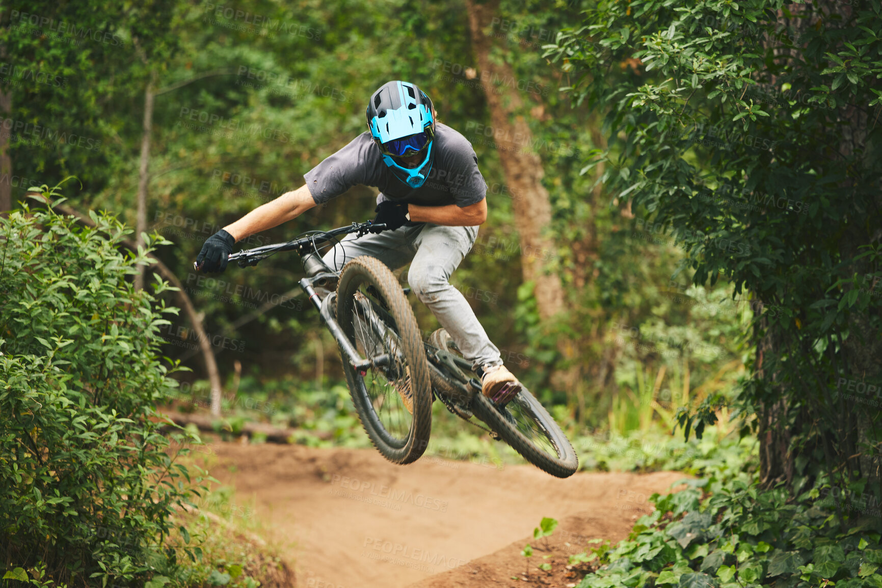 Buy stock photo Mountain bike, man and jump in park for extreme sports, cycling competition and adventure of action, challenge or courage. Bicycle, athlete and stunt in air for skill, adrenaline and freedom of racer