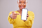 Phone screen, pointing and portrait of woman isolated on studio background, mobile app and advertising mockup. African person or online user on cellphone mock up, website space or social media design
