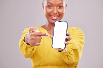 Buy stock photo Phone screen, pointing and portrait of woman isolated on studio background, mobile app and advertising mockup. African person or online user on cellphone mock up, website space or social media design