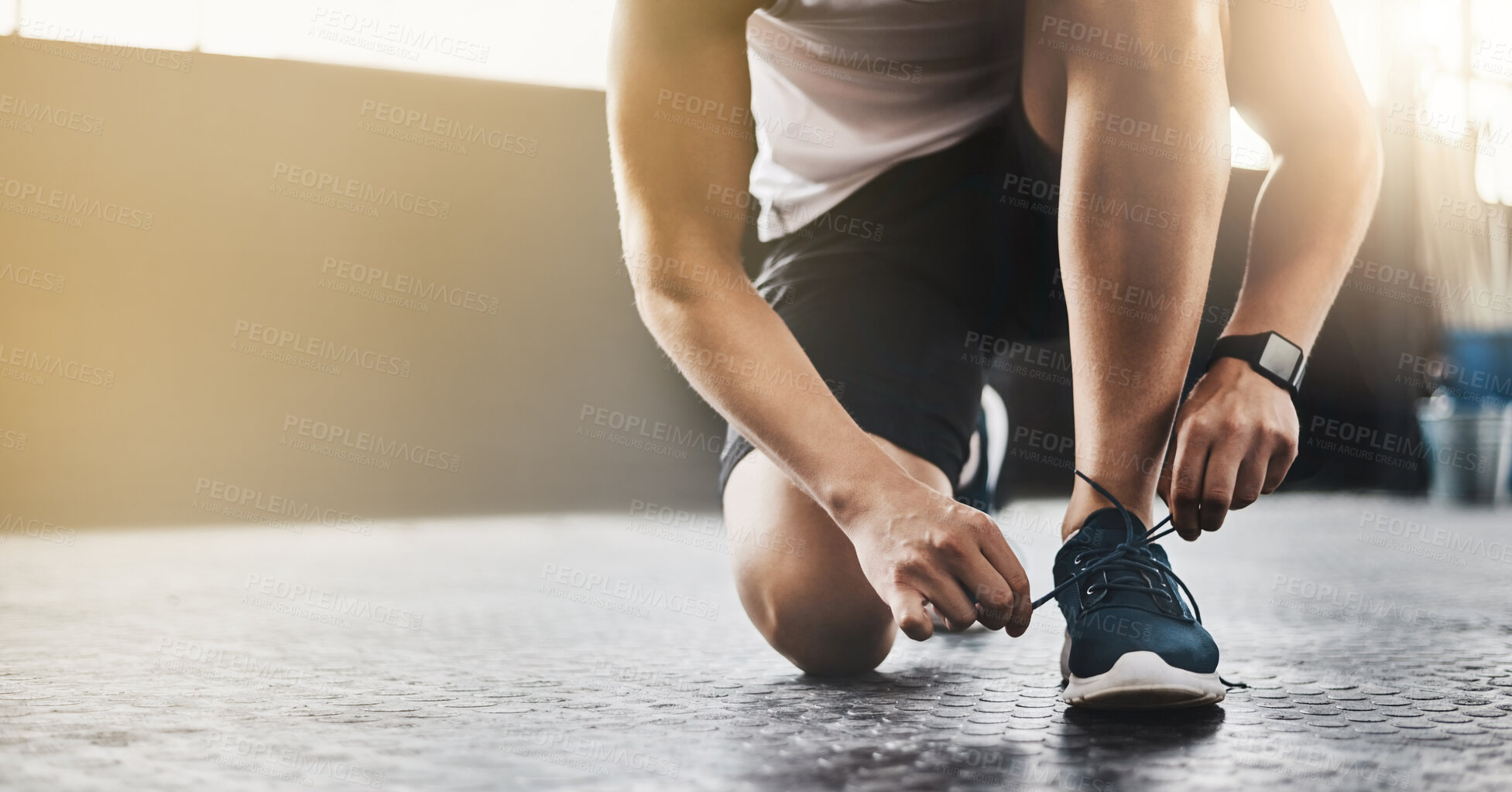 Buy stock photo Sports, athlete and man tie shoes in a gym before workout for health, wellness and endurance training. Fitness, sneakers and closeup of male person tying laces to start a exercise in sport center.