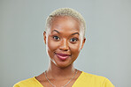 Happy, portrait and woman in studio with confidence, cool and edgy against a grey or wall background. Headshot, face and young african female model smile, cheerful and proud, satisfied and beautiful
