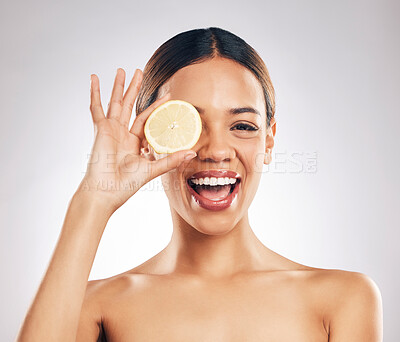 Buy stock photo Woman, lemon and studio portrait for beauty, wellness and excited with facial glow by white background. Girl, model and healthy skincare with youth, makeup and cosmetics for self care with funny face