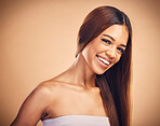 Happy, hair and portrait of woman with beauty in studio for wellness, keratin treatment and haircare. Salon, hairdresser and face of female person on orange background for growth, shine and texture