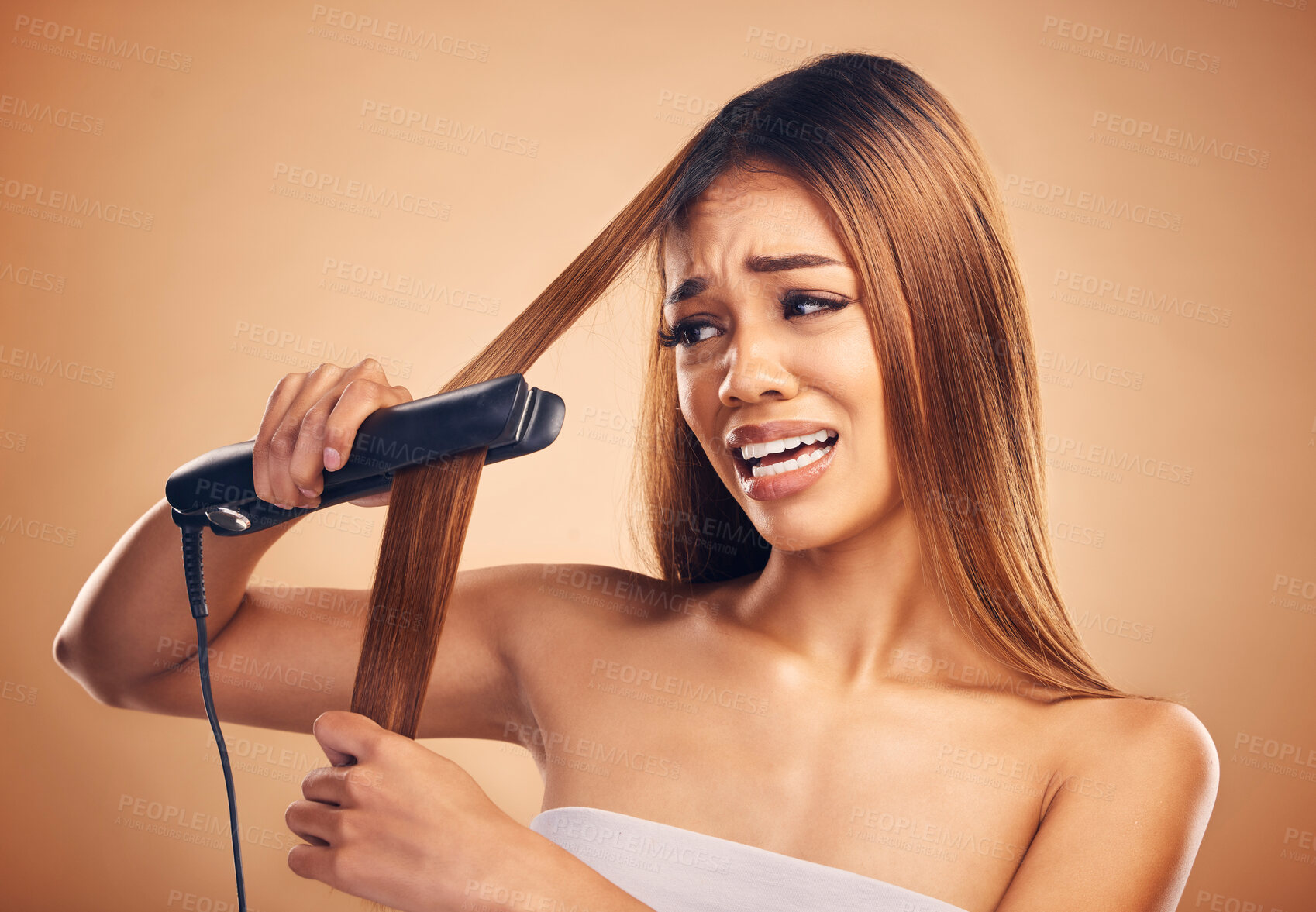 Buy stock photo Woman with flat iron, haircare fail and anxiety about heat damage with hairloss isolated on studio background. Electric hair straightener, female model worried about keratin treatment and hairstyle