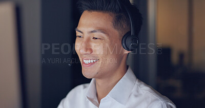 Buy stock photo Call center, night and face of Asian man with business, smile and headset in communication in dark office. Telemarketing, customer service or crm, happy help desk consultant for night support work