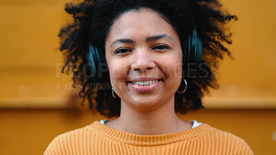 Buy stock photo Woman, headphones and music in portrait, street and city with smile, sound tech and freedom. African girl, audio streaming subscription and happy outdoor for listening, podcast or radio in metro road