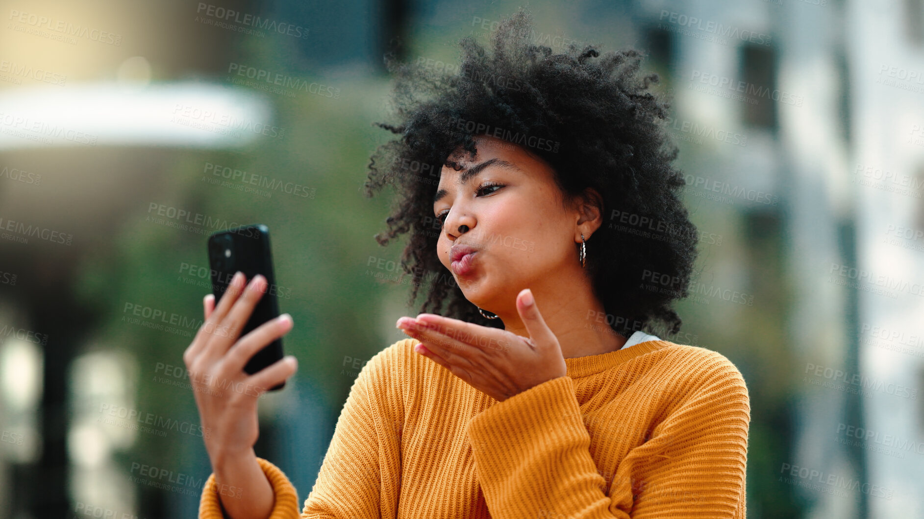 Buy stock photo Video call, phone and woman blowing a kiss in the city talking online and communication. Happy, love and a person or student on cellphone, mobile and live streaming for care, conversation or chat